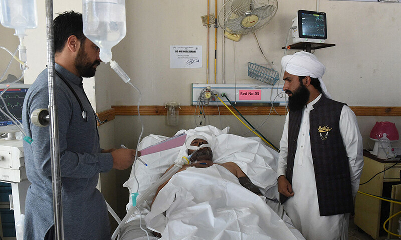 Relatives are standing next to blast victim at a hospital in Quetta on September 30, 2023, a day after suicide bomber targeted a 12th Rabiul Awwal procession in Mastung district.