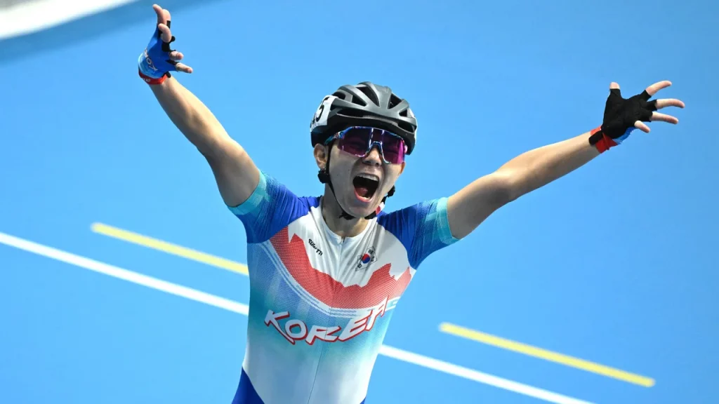 Jung prematurely celebrates after crossing the finish line in the men's final of the speed skating 3,000m relay race.